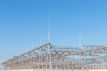 electric substation against a blue sky, electricity concept backgroundの写真素材