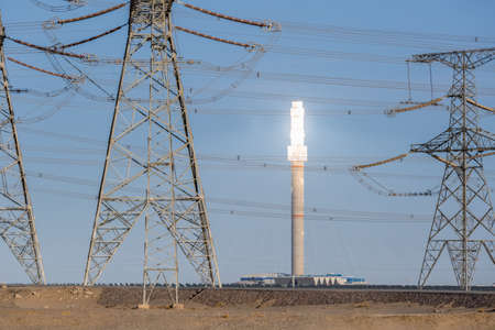 futuristic power station close-up, molten salt tower with power transmission tower, solar thermal power generationの写真素材