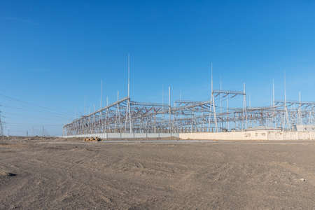 electric substation on western wilderness against a blue skyの写真素材