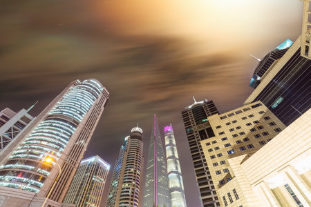 modern financial buildings in shanghai in evening, upward viewの写真素材