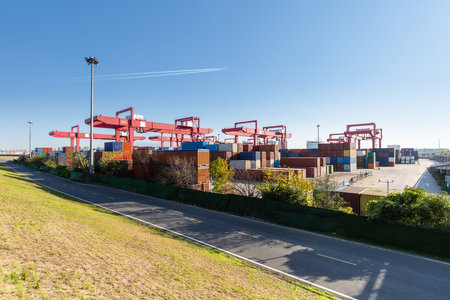 inland container yard against a blue sky, modern logistics backgroundの写真素材