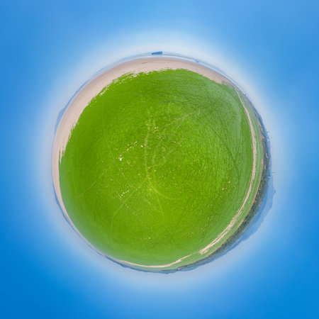 landscape of Poyang lake in drought, spherical panorama, large areas of green grass sea shoals and shoe hills in dry season, Jiujiang city, Jiangxi province, China.の写真素材