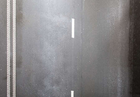 asphalt road in closeup shotの写真素材