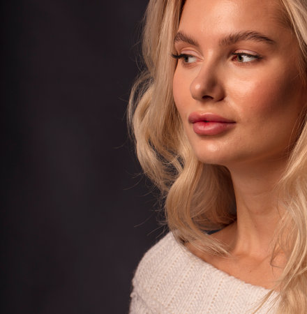Blonde, studio portrait of a young girlの写真素材