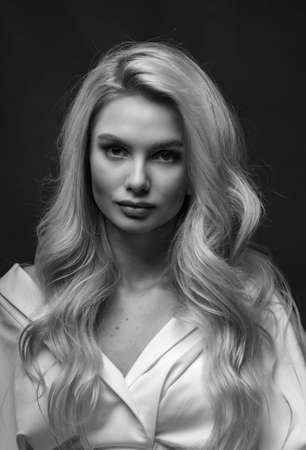 Blonde, studio portrait of a young girlの写真素材