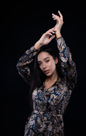 portrait of a young woman in the studio on a dark backgroundの写真素材