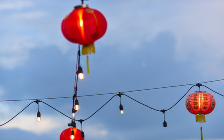 Hanging red lanterns on blue sky background,Thailand.の写真素材