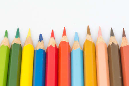 Many crayons sticks on a white background.の写真素材