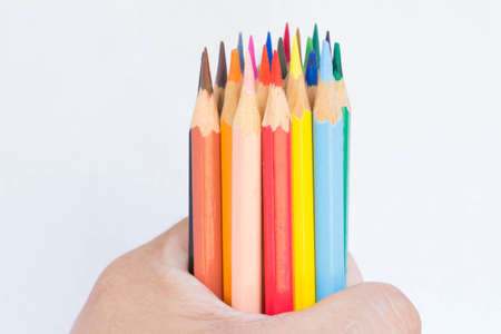 Many crayons sticks on a white background.の写真素材