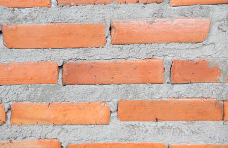 Walls made of red bricks and cement.