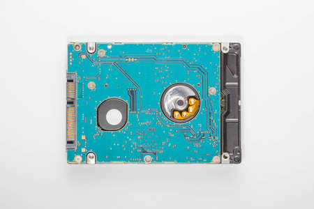 Hard drive inside the computer on a white background.の写真素材