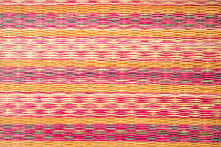 Close up of a straw mat as a background photo.