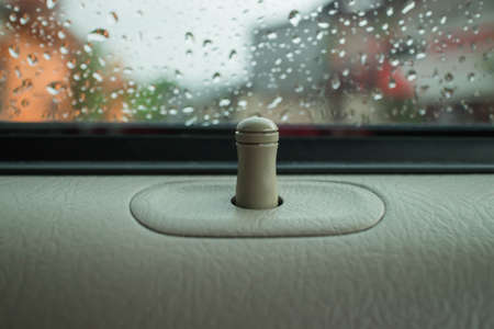 Lock the car door on a rainy day.の写真素材