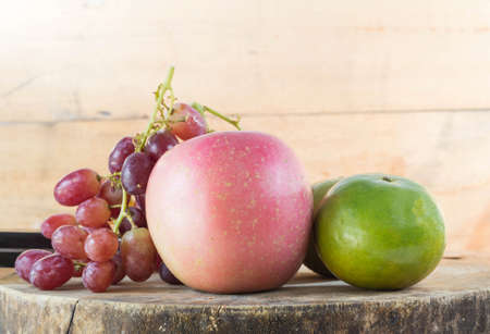 Vintage fruits on a wooden floor.の写真素材