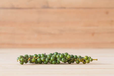 Fresh pepper on a wooden floor.の写真素材