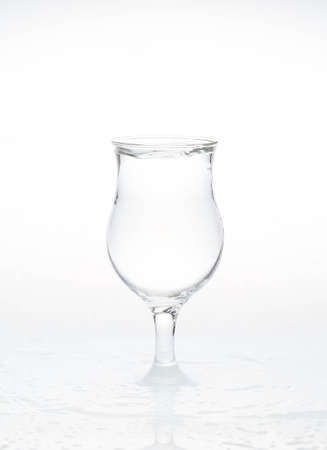 Glass of water with water splashes and wet.の写真素材