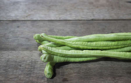 Yard Long Bean on wooden floor.の写真素材