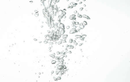 Bubbles in the water on a white background.の写真素材