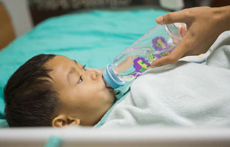 Pediatric patients lying on the bed.の写真素材