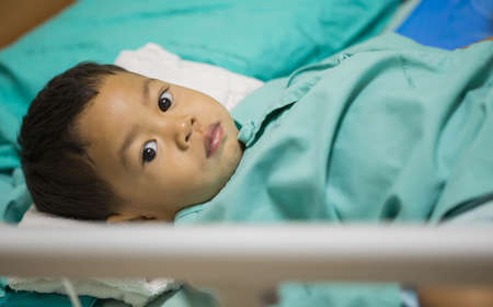 Pediatric patients lying on the bed.の写真素材