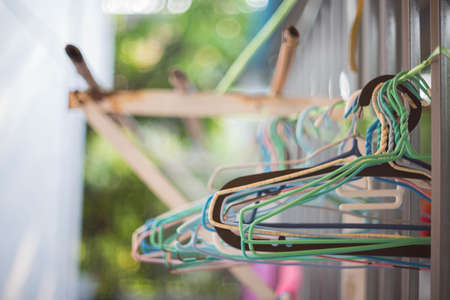 Clothes hanger hanging on the clothes line.の写真素材