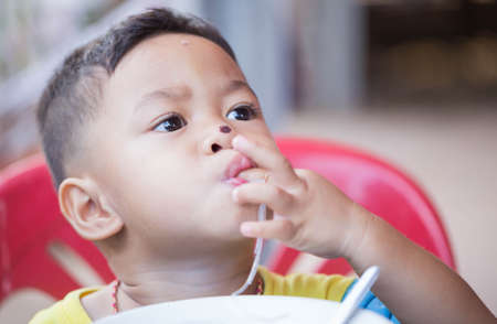 The child eating food yummy.