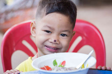 The child eating food yummy.