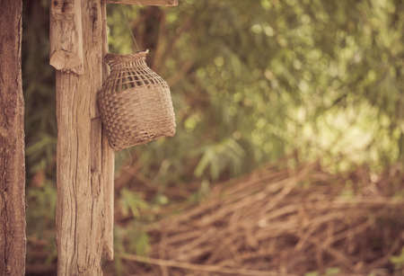 Basketry hanging on a pole vintage tone.の写真素材