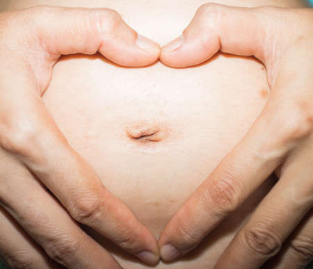 The pregnant woman's belly.の写真素材