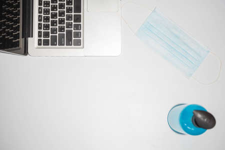 Notebook and face masks on a white background.の写真素材