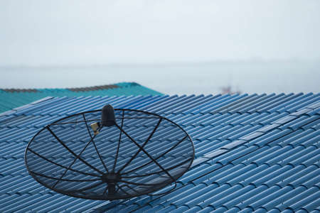 Satellite dish on roof in rains season.の写真素材