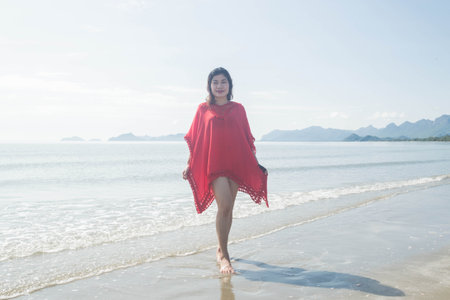 Woman portrait standing on beach.の写真素材