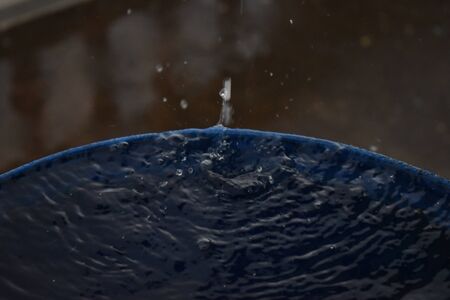 Top view Closeup blue water rings, Circle reflections in drum filled with waterの写真素材
