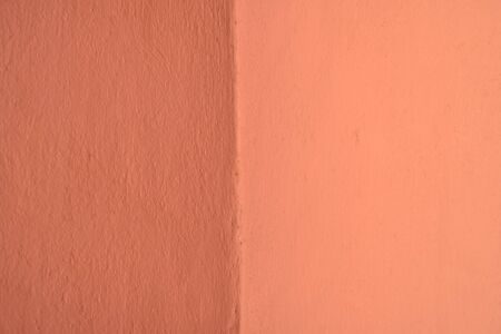 Orange painted wall texture with copy space for writing text on background.