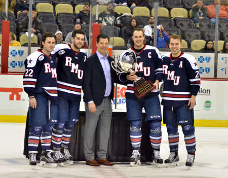 Former Pittsburgh Penguin and current assistaint general manager Billy Guerrin presents the winners...