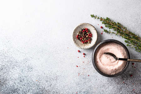 pink Himalayan salt in a bowl on a light background. Top view, place for textの写真素材