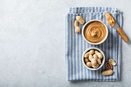 Peanut butter in a ceramic bowl on napkin