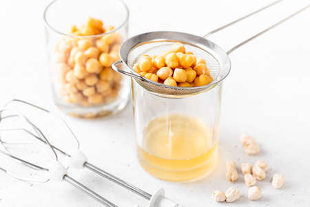Chickpea liquid brine draining, aquafaba. Replace egg for vegan recipe