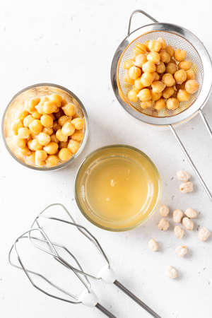 Aquafaba, chickpea water brine draining. Replace egg for vegan recipeの写真素材