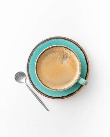 coffee in a blue cup on a white background, top view