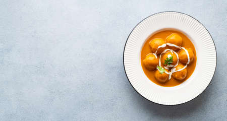Malai Kofta Curry in a white plate, view from above, copy spaceの写真素材