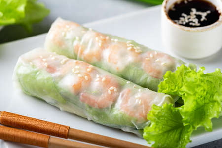 Spring rolls with shrimp, carrots, cucumber, green onions and rice noodles, selective focus