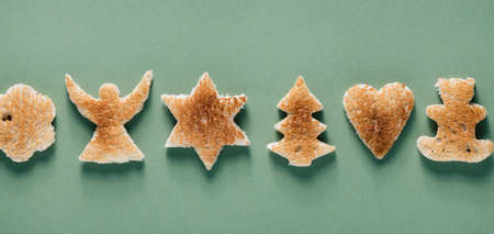 Creative Christmas background, toast with Christmas tree, angel, teddy bear, star