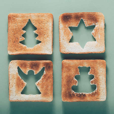 Creative Christmas background, toast with Christmas tree, angel, teddy bear, starの写真素材