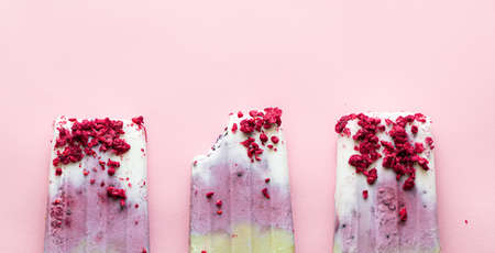 homemade vegan ice cream with berries, matcha tea and freeze-dried raspberries, top view