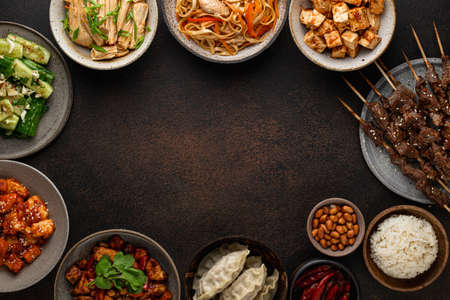 chinese food, chinese traditional cuisine dishes on dark background, top view, place for textの写真素材