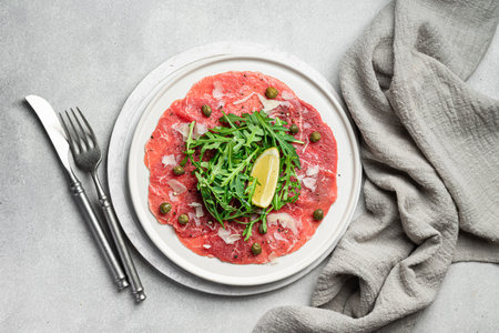 Beef carpaccio,traditional italian dish, flat layの写真素材