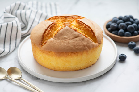 Japanese cheesecake on a white plate, selective focus