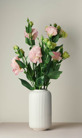 Eustoma bouquet in a white minimalist ceramic vase in Scandinavian styleの写真素材