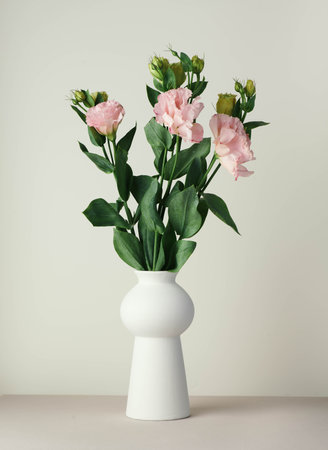 Eustoma bouquet in a white minimalist ceramic vase in Scandinavian styleの写真素材